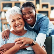 Senior, happy women or portrait with nurse hug for healthcare, assisted living or volunteer service. Female people, caregiver or smile with love, elderly care or retirement wellness at old age home Senior, happy women or portrait with nurse hug for healthcare, assisted living or volunteer service. Female people, caregiver or smile with love, elderly care or retirement wellness at old age home.